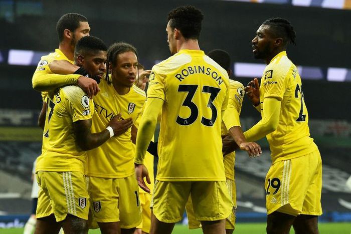 Fulham players celebrate their goal at Tottenham