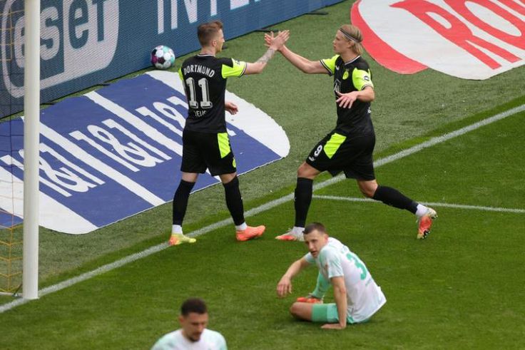 Haaland (R) celebrates with Dortmund captain Reus after scoring in Sunday's 4-1 home win against Werder Bremen