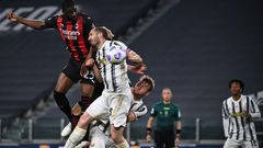AC Milan's English defender Fikayo Tomori (Top L) headed in a third goal against Juventus in Turin.
