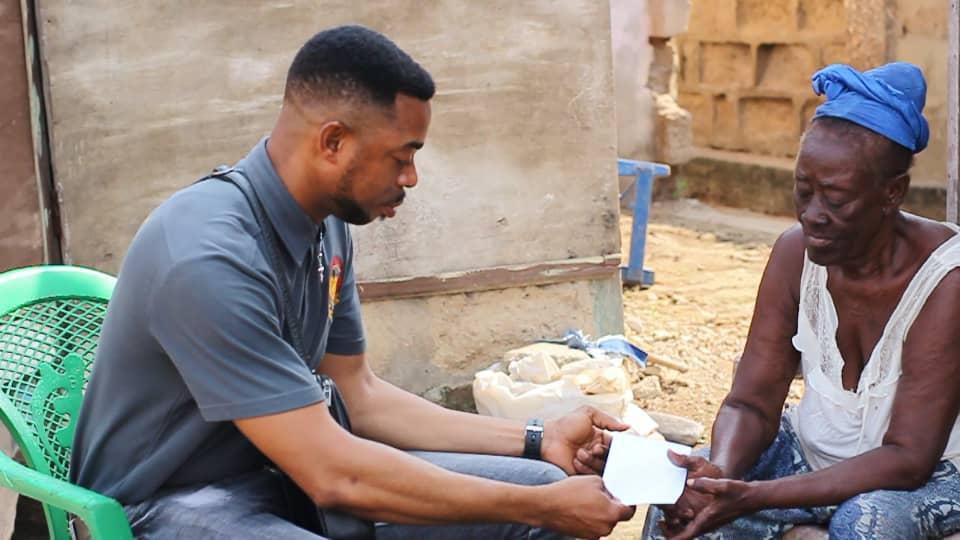 Lance Corporal Simon Agbeko gives to the aged