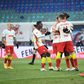 Leipzig celebrate after Dani Olmo converts a penalty against Augsburg