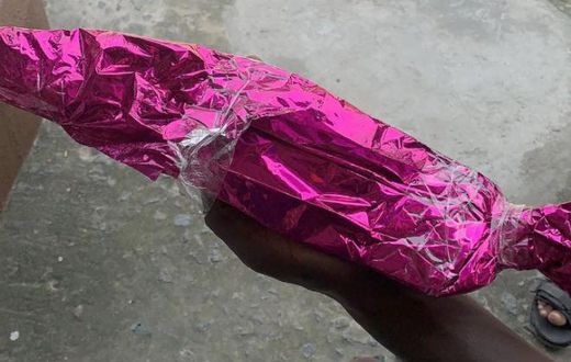 Confusion as bride receives wrapped cutlass from anonymous guest