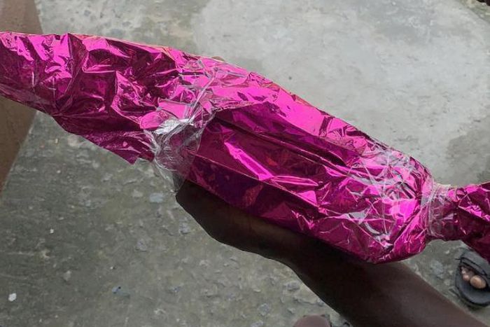Confusion as bride receives wrapped cutlass from anonymous guest
