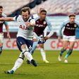 Spot on: Harry Kane (2nd left)sealed a much-needed win for Tottenham at Aston Villa
