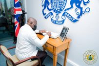 President Akufo-Addo signing Prince Philip's book of condolence