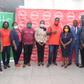 Officials of Absa Bank and Transitions in a group picture