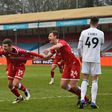 Crawley's Jordan Tunnicliffe (C) celebrates after scoring against Leeds