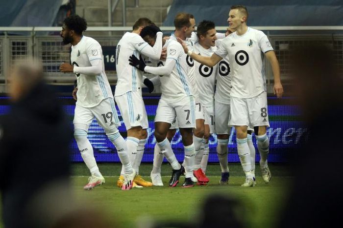 Minnesota United players celebrate with Kevin Molino (7) after a goal during the first half of the MLS playoff game against Sporting Kansas City