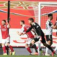 Arsenal striker Eddie Nketiah (L) celebrates scoring against Fulham