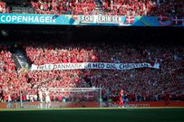 Danish supporters take part in a moment of applause for Christian Eriksen during the Euro 2020 game against Belgium