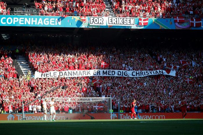 Danish supporters take part in a moment of applause for Christian Eriksen during the Euro 2020 game against Belgium