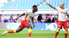 Amadou Haidara (L) celebrates scoring RB Leipzig's opening goal at home to Stuttgart on Sunday