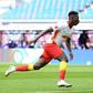Amadou Haidara (L) celebrates scoring RB Leipzig's opening goal at home to Stuttgart on Sunday