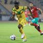 Moussa Kone (L) of Mali is pursued by Abdelmounaim Boutouil of Morocco during the African Nations Championship final in Yaounde Sunday.