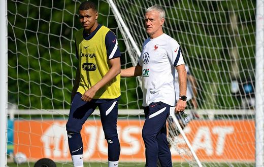 France striker Kylian Mbappe (L) and coach Didier Deschamps (R) prepare for Tuesday's Euro 2020 clash with Germany
