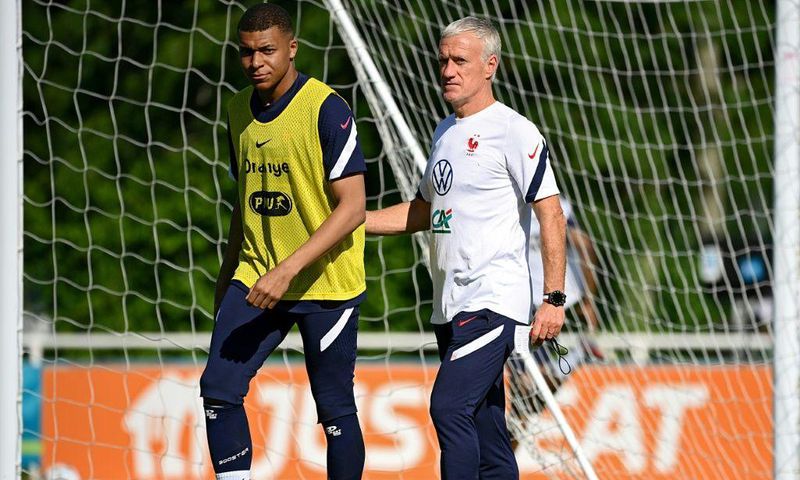 France striker Kylian Mbappe (L) and coach Didier Deschamps (R) prepare for Tuesday's Euro 2020 clash with Germany
