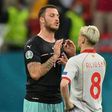 Austria's Marko Arnautovic (left) confronts North Macedonia defender Ezgjan Alioski in the Bucharest match on Sunday