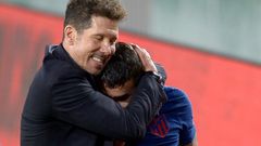 Atletico Madrid coach Diego Simeone hugs Angel Correa at the end of the game