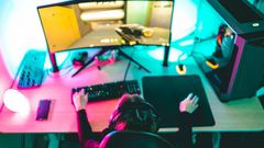 A woman playing video games on a computer.