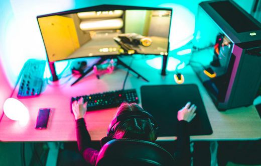 A woman playing video games on a computer.