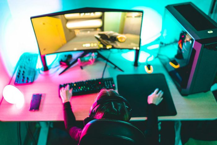A woman playing video games on a computer.