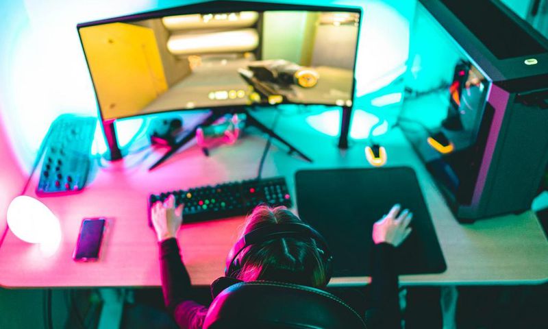 A woman playing video games on a computer.