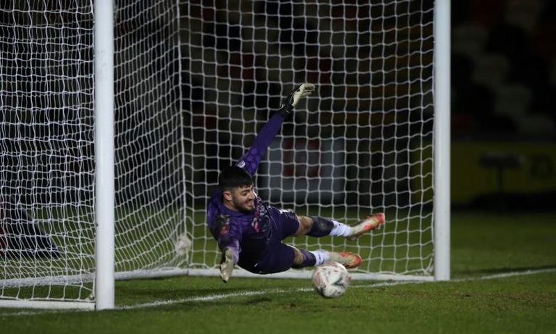 Newport County's goalkeeper Tom King in action