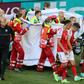 Players escort paramedics as Denmark's midfielder Christian Eriksen is evacuated from the pitch during the UEFA EURO 2020 Group B football match between Denmark and Finland at the Parken Stadium in Copenhagen on June 12, 2021.