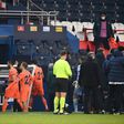 Istanbul Basaksehir players walk off the pitch at the Parc des Princes as their Champions League game with PSG was suspended over allegations of racism by one of the match officials