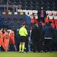 Istanbul Basaksehir players walk off the pitch at the Parc des Princes as their Champions League game with PSG was suspended over allegations of racism by one of the match officials