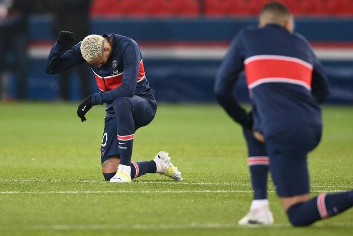 Neymar taking a knee before the match restarted. He went on to score a hat-trick for PSG in their 5-1 win