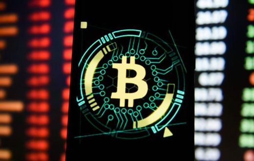Bitcoin logo is seen displayed on an Android mobile phone