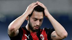 AC Milan's Turkish midfielder Hakan Calhanoglu reacts during the Italian Serie A football match Lazio vs Ac Milan at Olympic stadium in Rome on April 26, 2021.