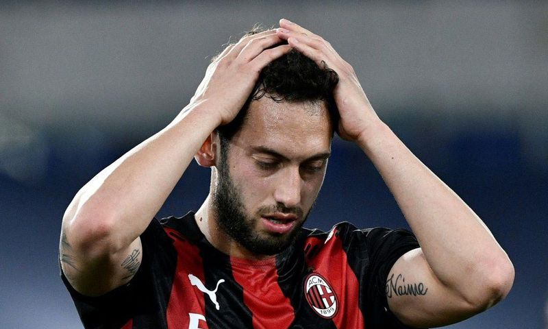 AC Milan's Turkish midfielder Hakan Calhanoglu reacts during the Italian Serie A football match Lazio vs Ac Milan at Olympic stadium in Rome on April 26, 2021.