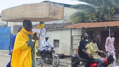 Archbishop Samson Benjamin embarks on a one-man protest with a coffin on his head