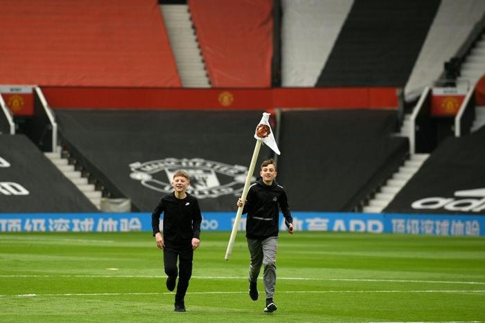 A fan invasion forced the postponement of Manchester United's match with Liverpool on May 2