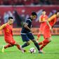 Guam (in black) play China on Sunday
