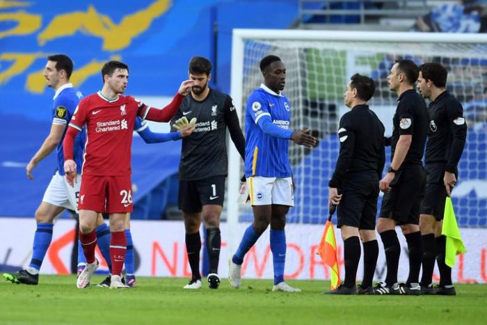 Liverpool defender Andrew Robertson complains to the officials