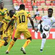 Guinea midfielder Sylla (R) scored first in a 2-0 win over hosts Cameroon