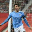 John Stones opened the scoring as Manchester City beat Manchester United to reach the League Cup final