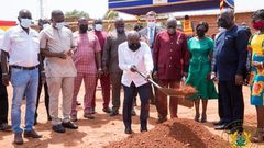 President cutting the sod