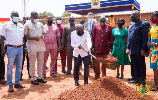 President cutting the sod