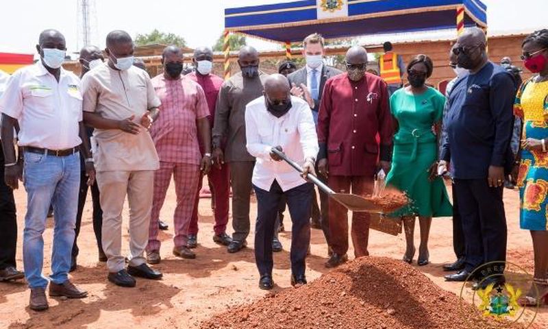 President cutting the sod