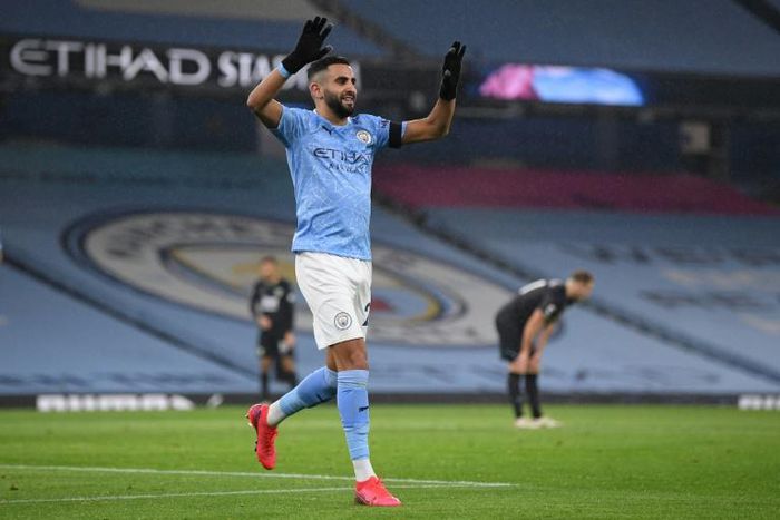 Algeria captain Riyad Mahrez celebrates completing his hat-trick for Manchester City against Burnley.