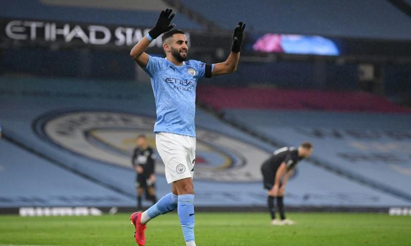 Algeria captain Riyad Mahrez celebrates completing his hat-trick for Manchester City against Burnley.