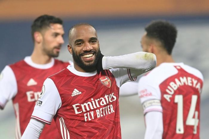 Smiling again: Alexandre Lacazette (centre)scored twice in Arsenal's 4-0 thrashing of West Brom