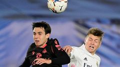 Toni Kroos (R) heads the ball with Real Sociedad's Spanish midfielder Martin Zubimendi during Monday's 1-1 draw