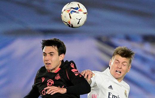 Toni Kroos (R) heads the ball with Real Sociedad's Spanish midfielder Martin Zubimendi during Monday's 1-1 draw