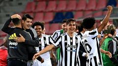Juventus forward Paulo Dybala (C) and Alvaro Morata (2ndL) celebrate after booking a Champions League berth.
