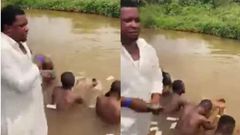 Pastor sprays cash on naked men inside river as he performs money ritual